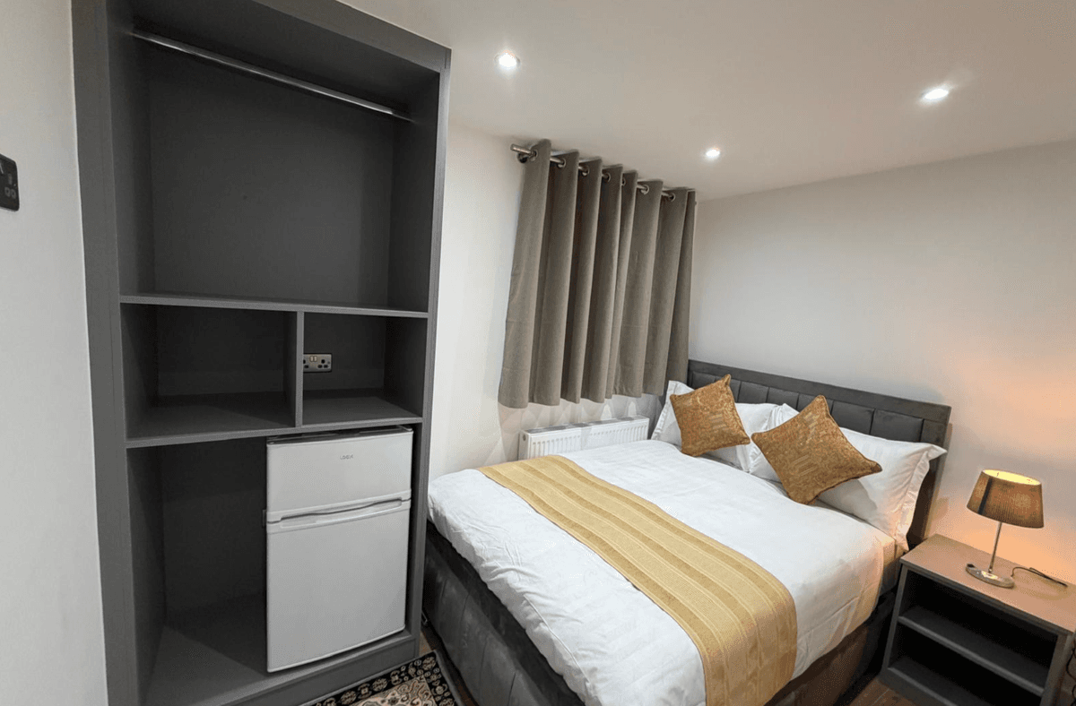 Bedroom — shelving & mini fridge
